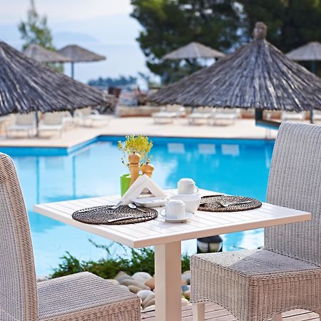 Alia Palace Hotel - Adults Only 16+ Chalkidike Exteriör bild A poolside table at a hotel