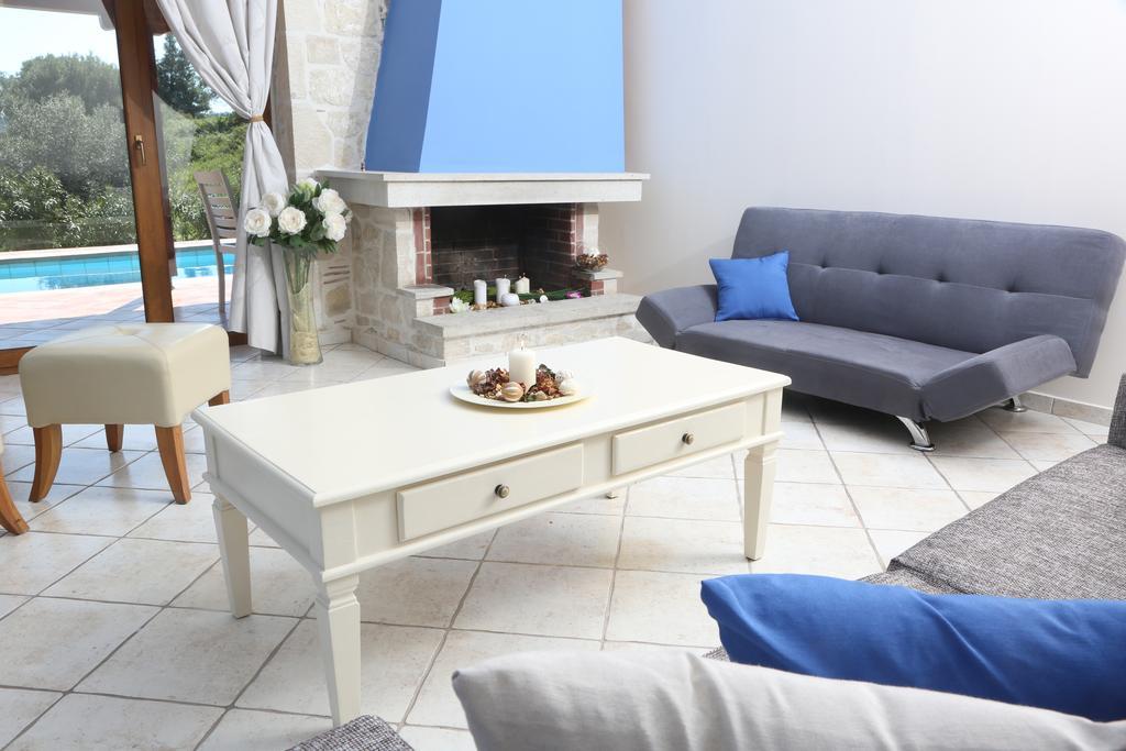 Alia Palace Hotel - Adults Only 16+ Chalkidike Exteriör bild A living room with a fireplace