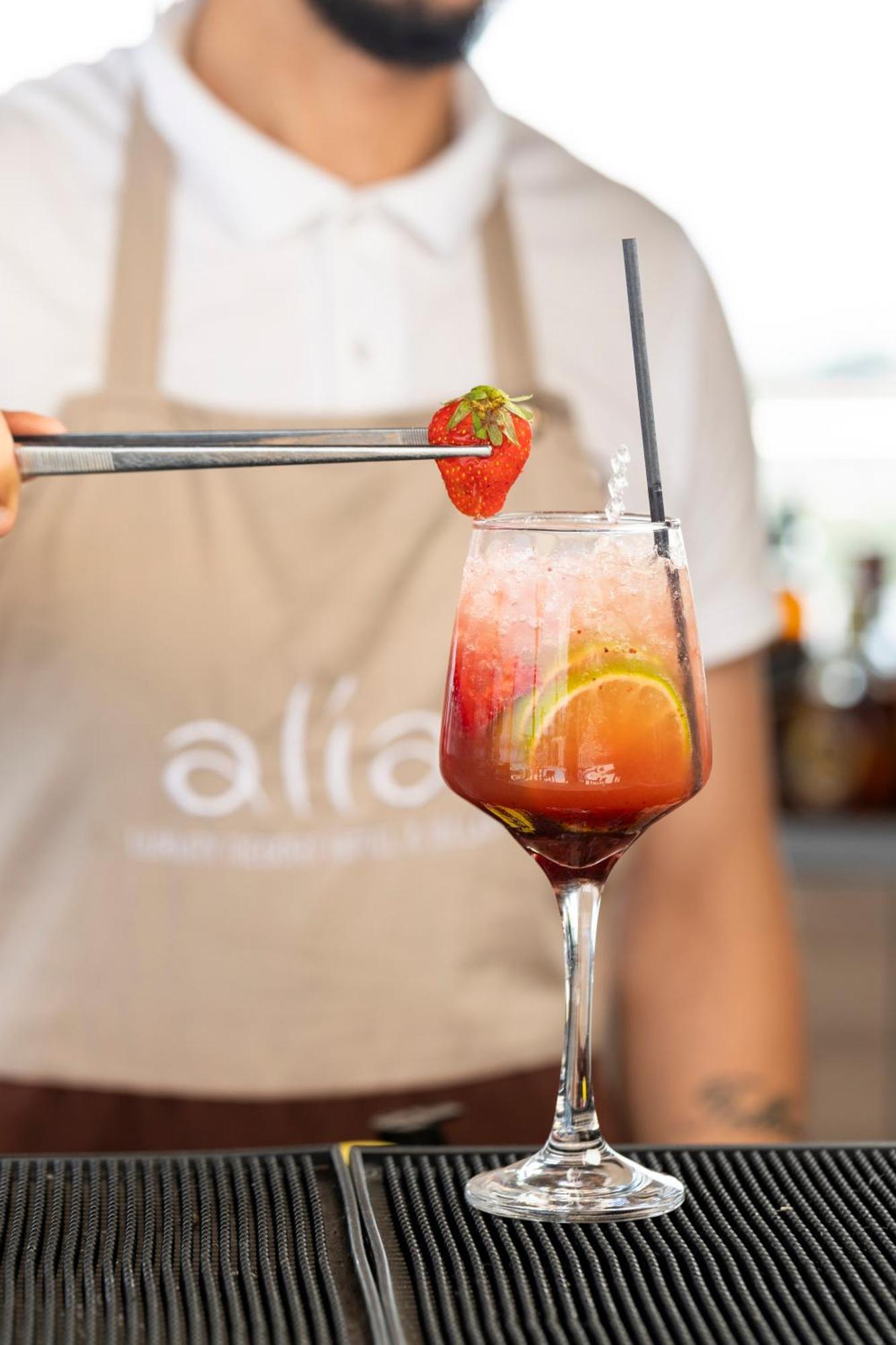 Alia Palace Hotel - Adults Only 16+ Chalkidike Exteriör bild A strawberry being placed on a strawberry bellini